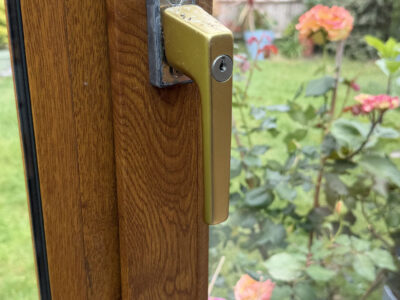 Brass uPVC window handleset fitted in Chichester - Before