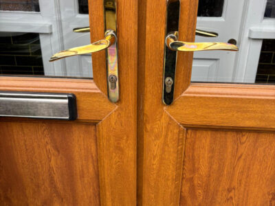 Pair of brass lever lever upvc door handleset in Portsmouth - Before